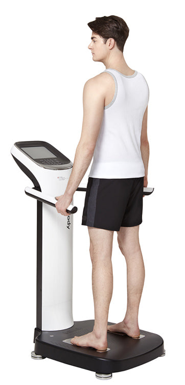 Man using body composition analyzer for fitness and health tracking